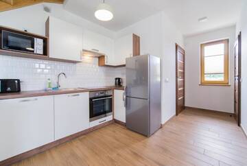 Фото номера Двухуровневые апартаменты Дома для отпуска Villa Arkadia RESORT г. Лукенцин 9